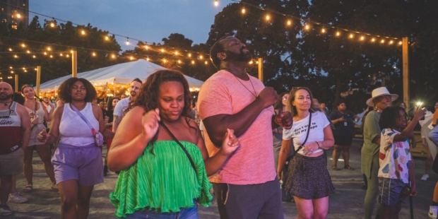 People dancing in crowd.