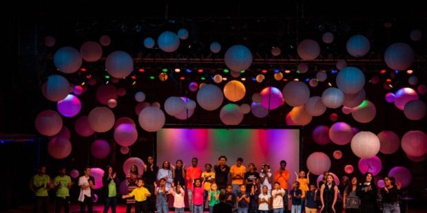 Children performing on stage.